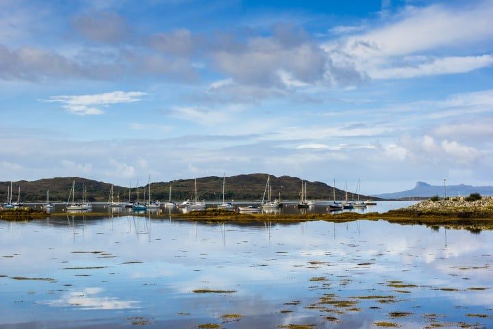 Yachts and motor cruisers moored in Arisalg marina, Loch nan Ceall, Locharbar, Highland region, Scotland.