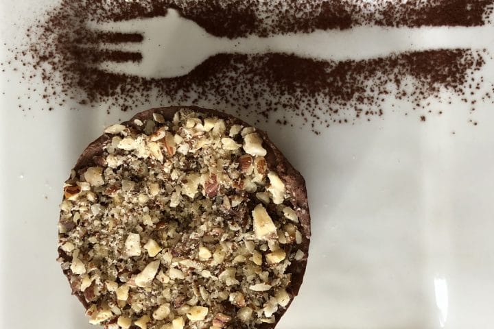 Chocolate and nut dessert with cocoa powder dusting